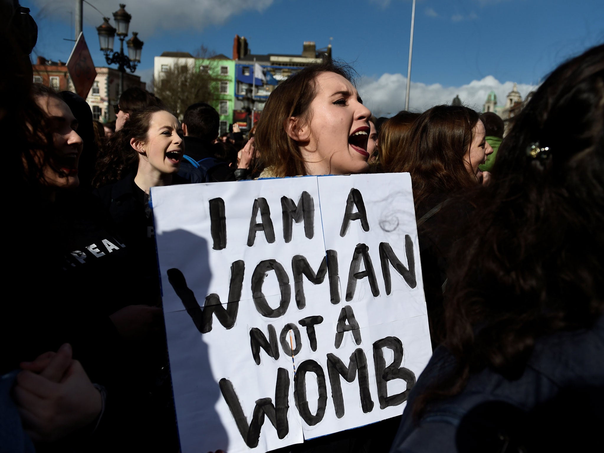 Campaigners stage a protest to demand more liberal abortion laws in Dublin