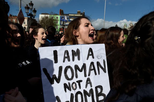 Campaigners stage a protest to demand more liberal abortion laws in Dublin