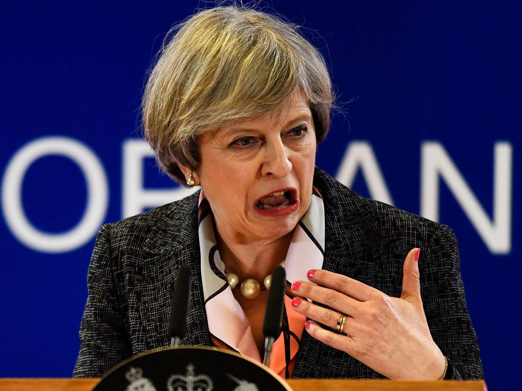 Theresa May laughing in the Commons chamber before the Budget yesterday - but her happy mood did not last