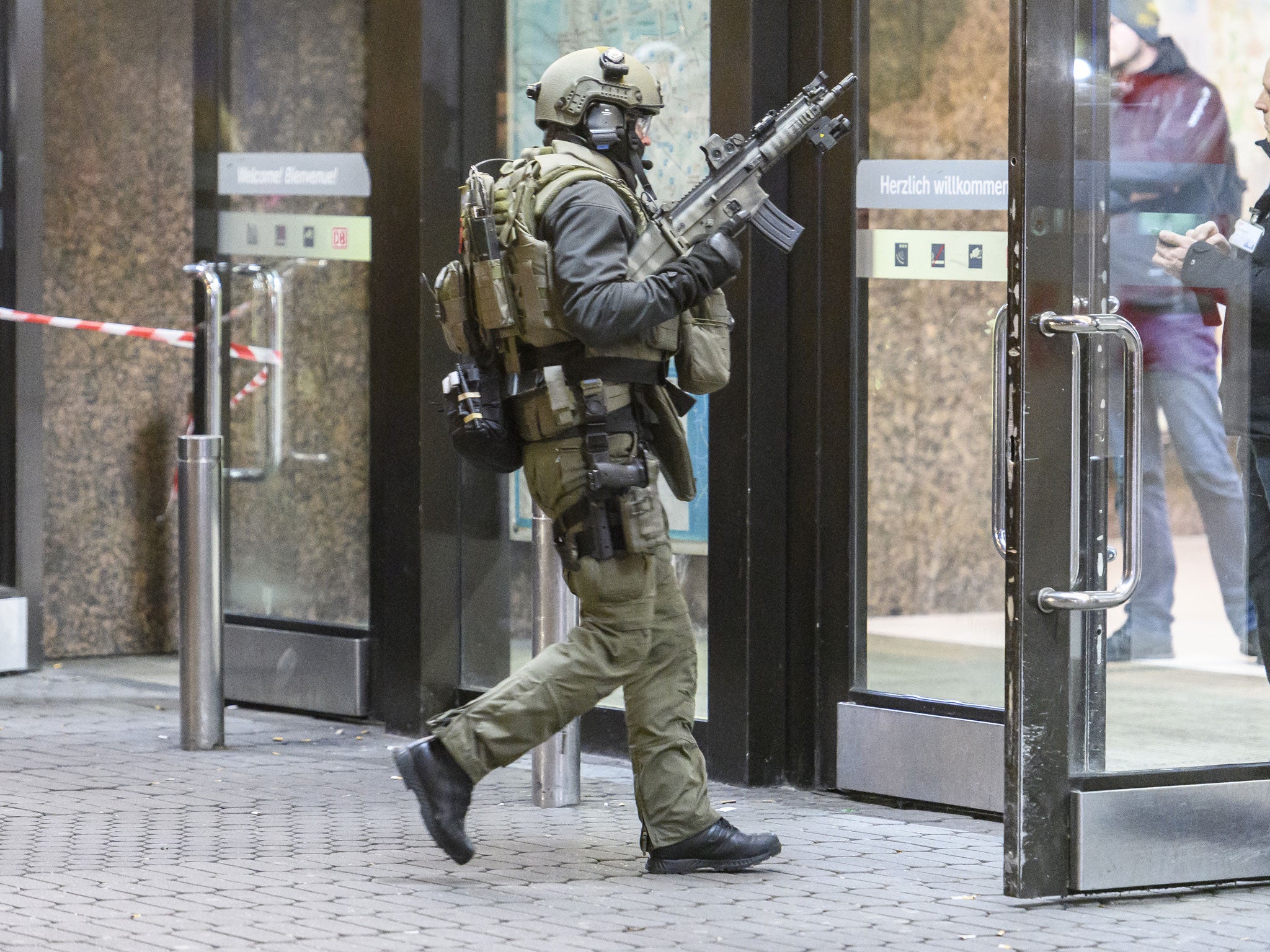 Police enter the main railway station in Dusseldorf following what police described as an axe attack