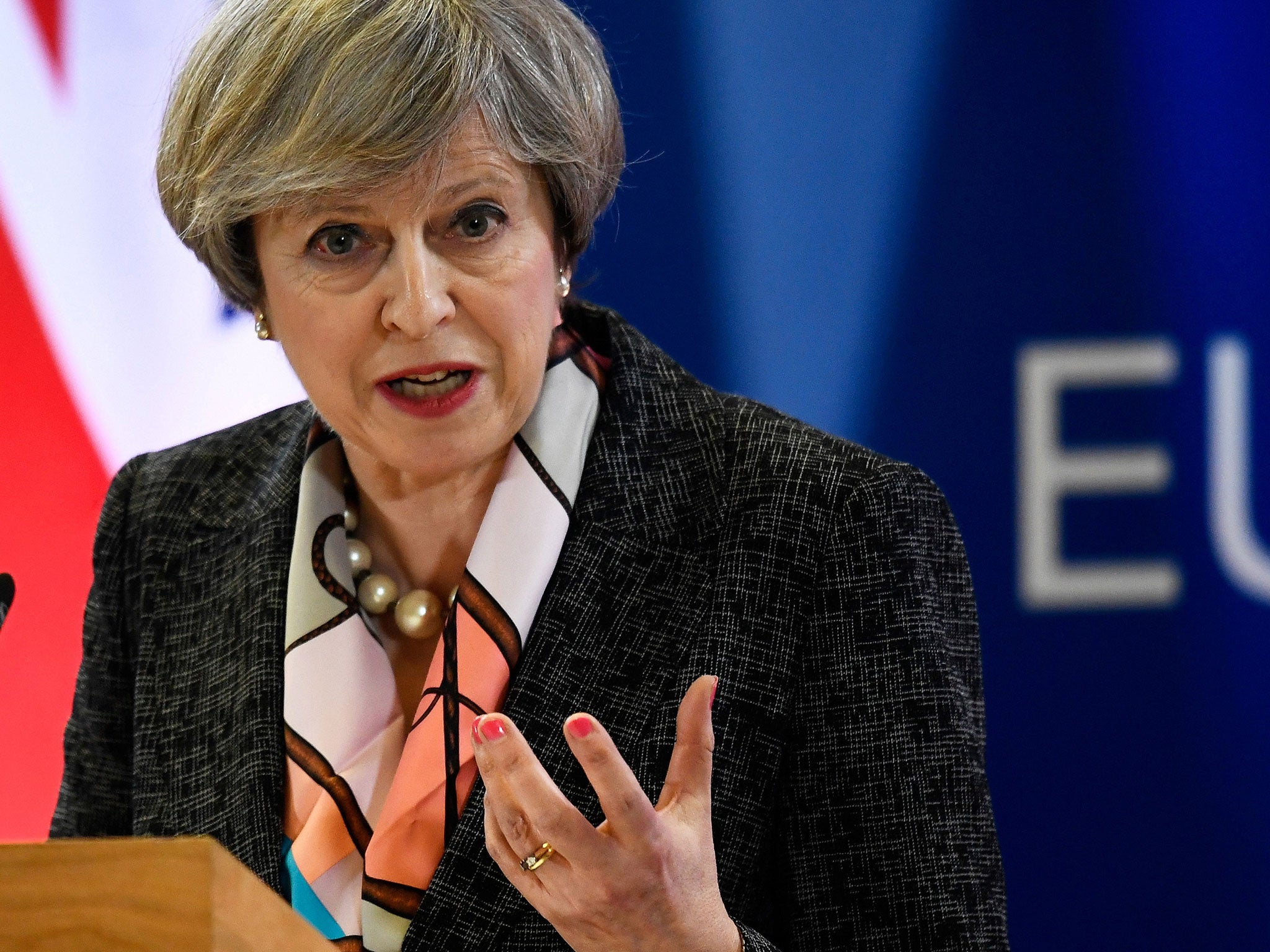 Theresa May attends a news conference during the EU Summit in Brussels