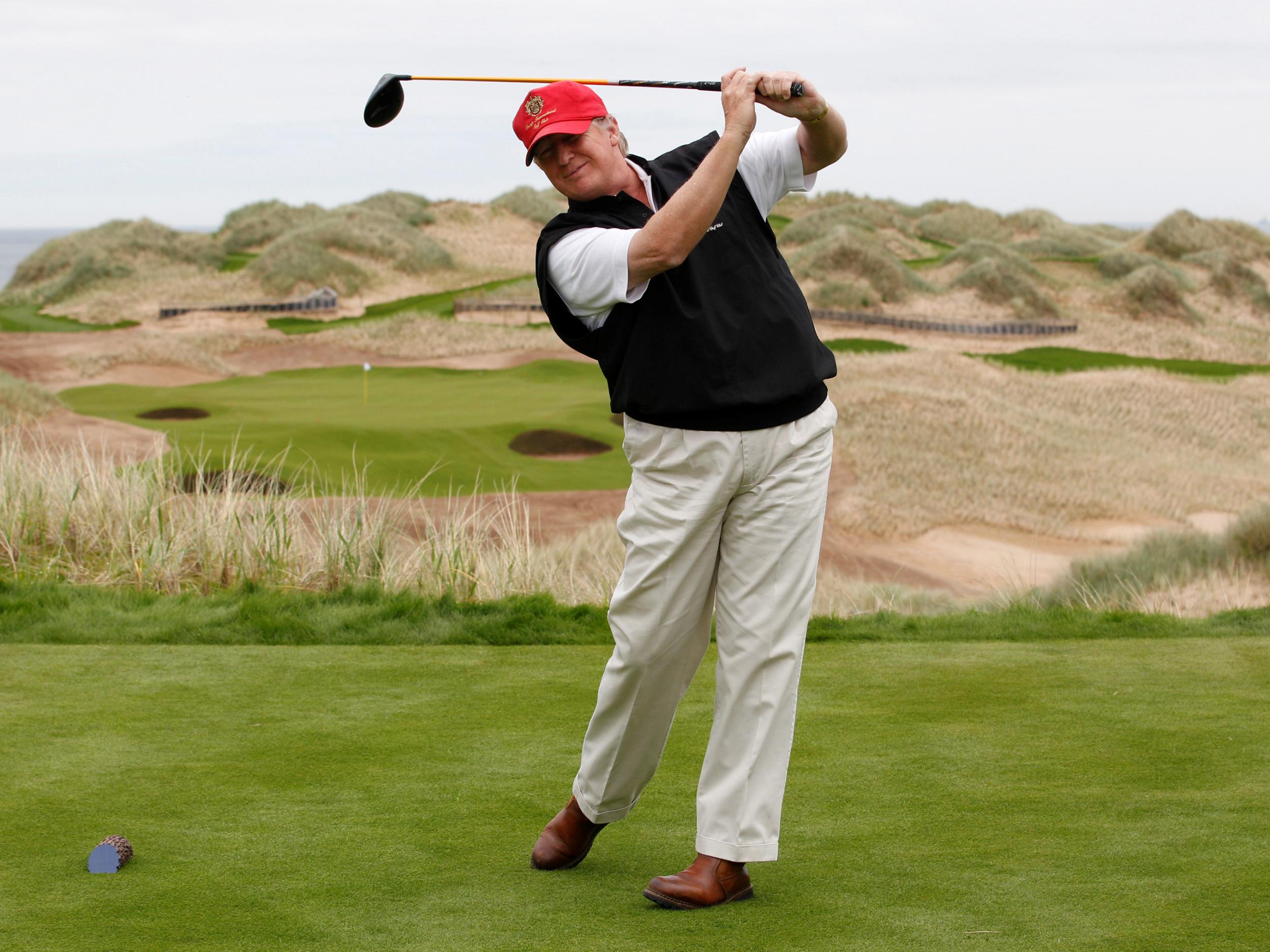 Donald Trump practices his swing