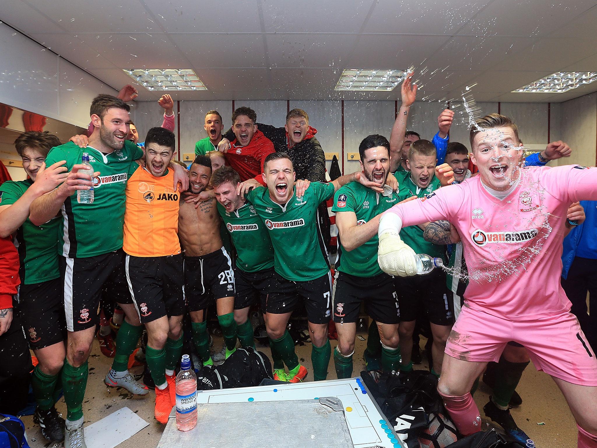 Lincoln City celebrate their win over Burnley in the FA Cup