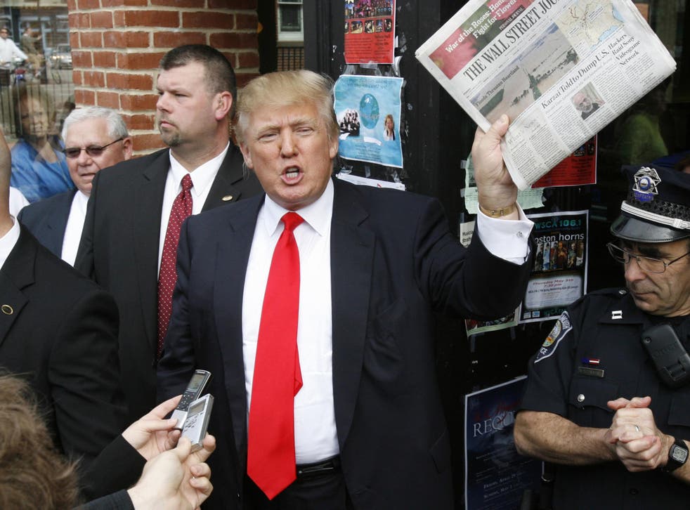 The President brandishing a copy of the Wall Street Journal on the campaign trail
