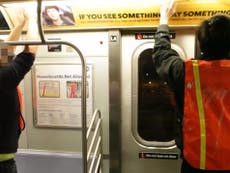 New York subway signs replaced with anti-Donald Trump posters