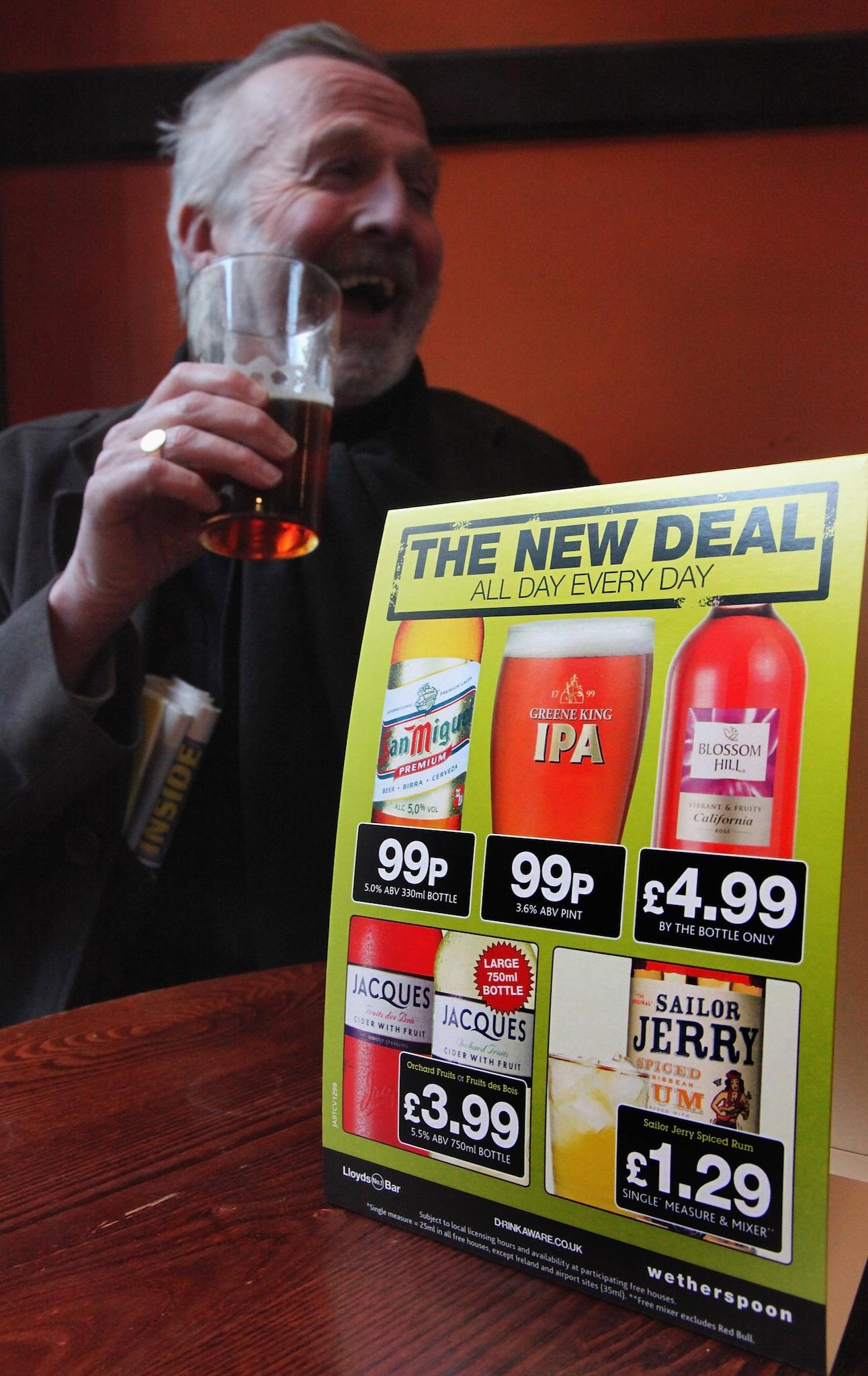 A drinker enjoys a pint of beer at a Wetherspoon in Bristol