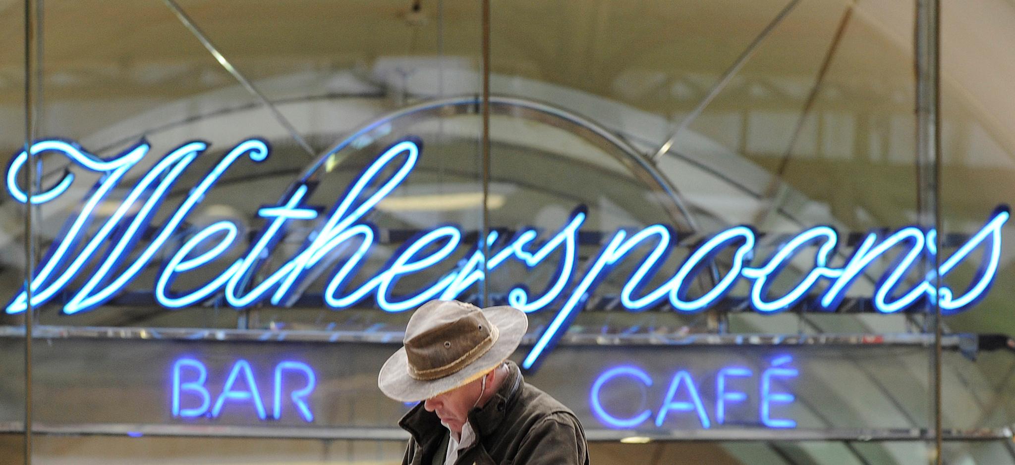 A Wetherspoon's logo is seen at a bar in central London March 13, 2009