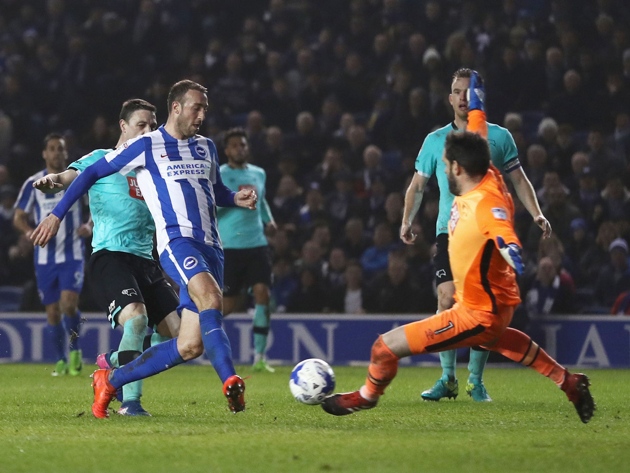 Glenn Murray shoots past Scott Carson to score Brighton's third