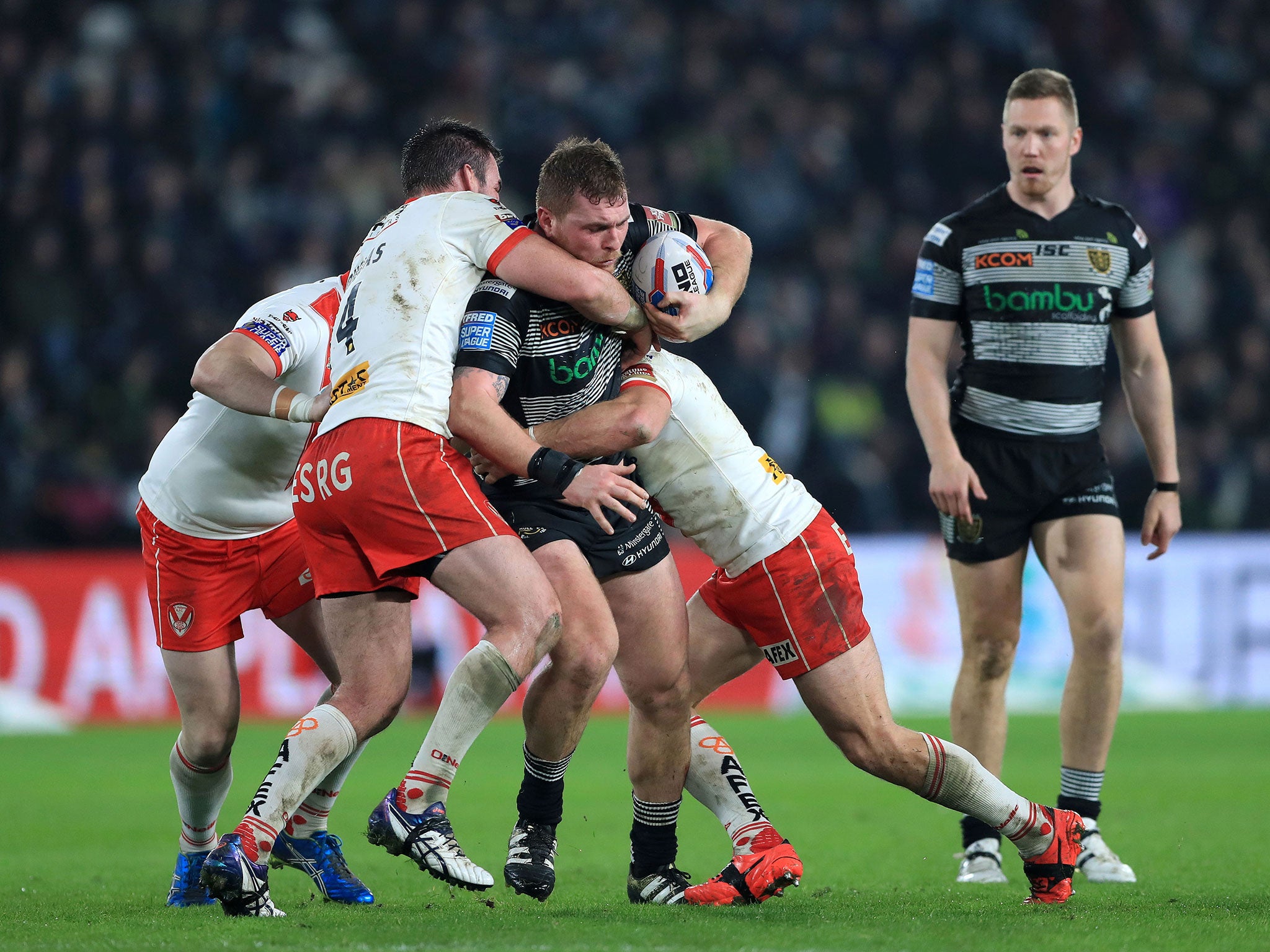 Scott Taylor is tackled by St Helens' defence