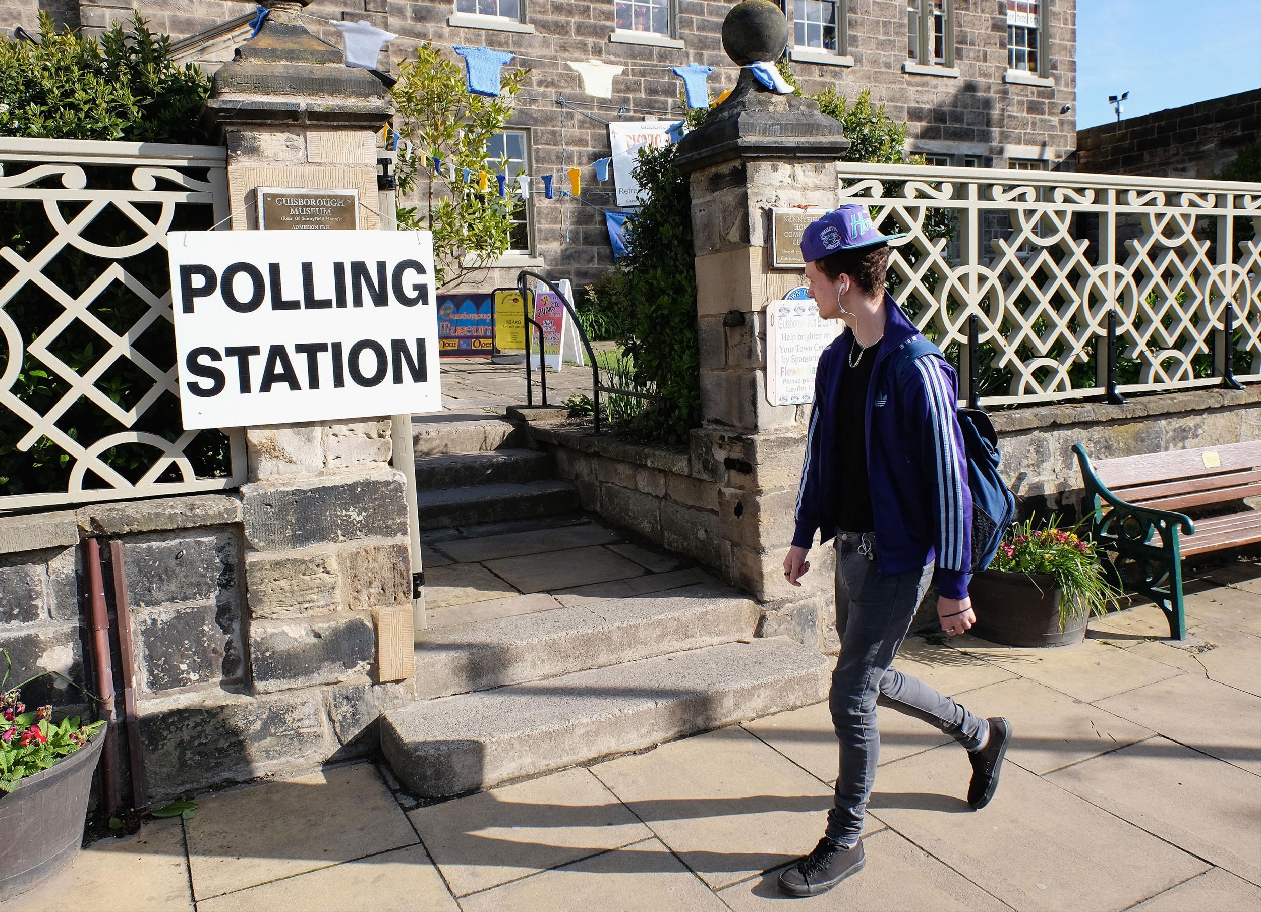 A man walks past a polling station in Guisborough on 7 May 2015