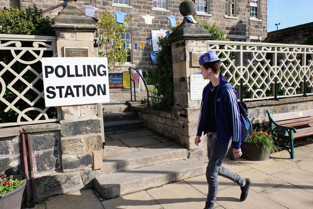 A man walks past a polling station in Guisborough on 7 May 2015