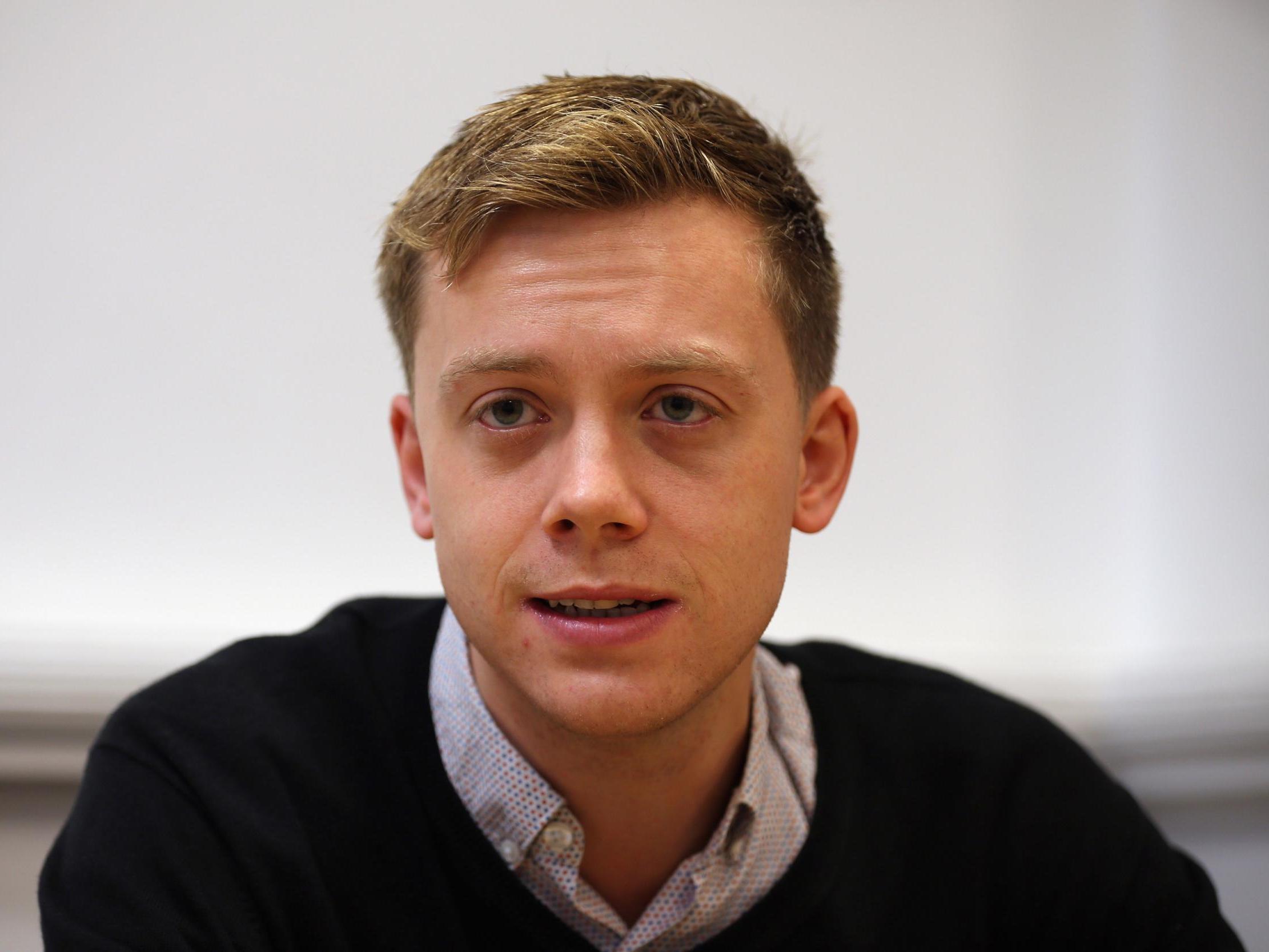 Owen Jones speaks at a meeting of activists