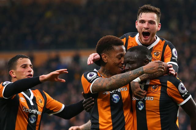 Oumar Niasse celebrates with team-mates after putting Hull ahead
