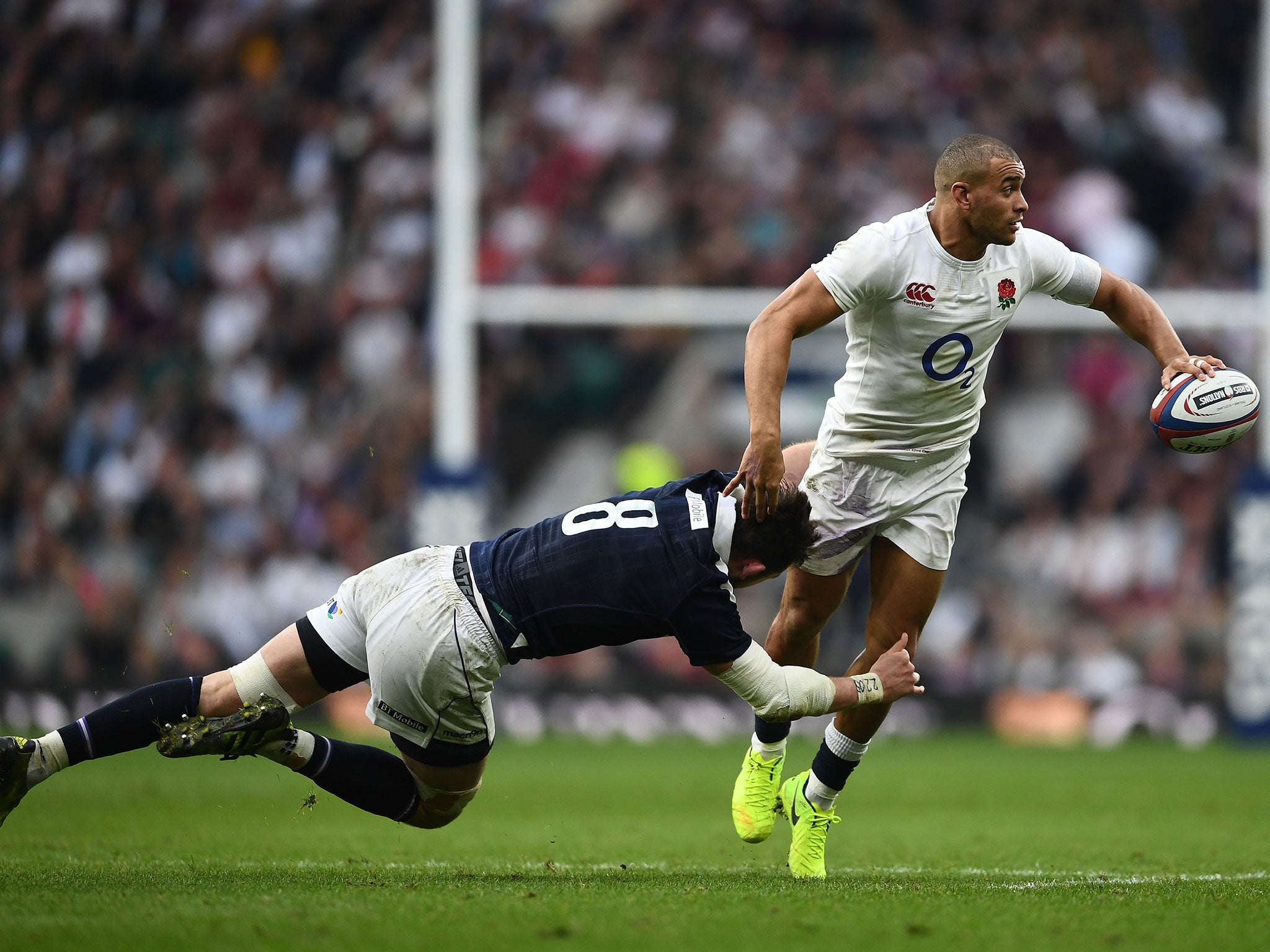 Jonathan Joseph looks for the offload after being tackled by Ryan Wilson