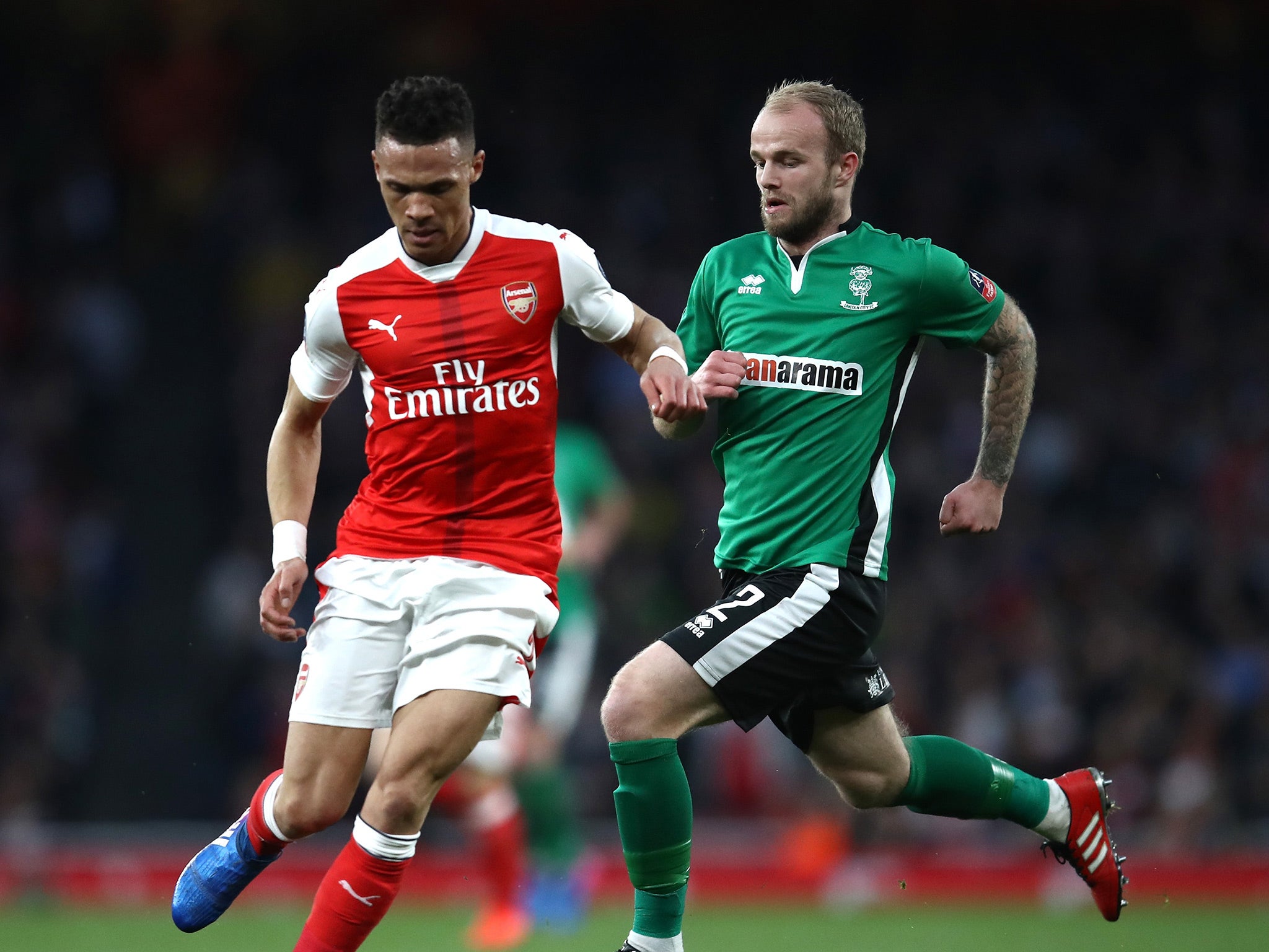 Kieran Gibbs and Bradley Wood battle for the ball at the Emirates