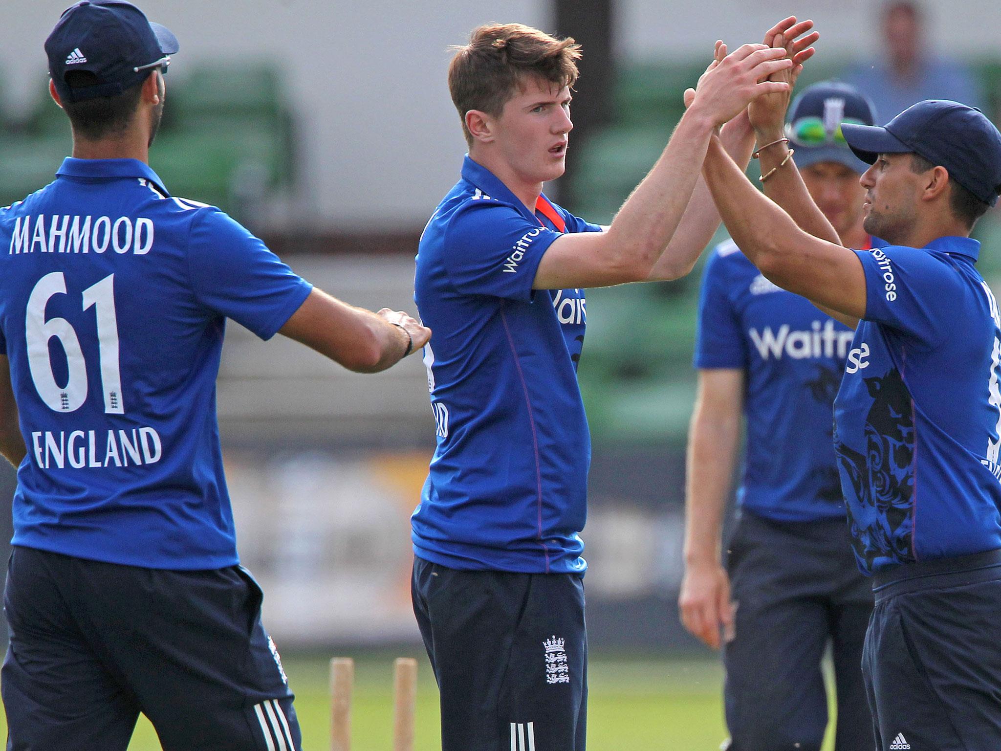 George Garton is congratulated by Brett D'Oliveira after taking the wicket of Thisara Perera