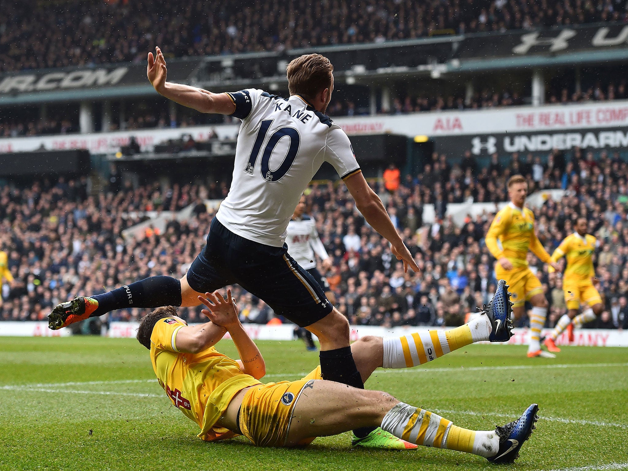 Kane's ankle was trapped under the leg of Millwall defender Jake Cooper