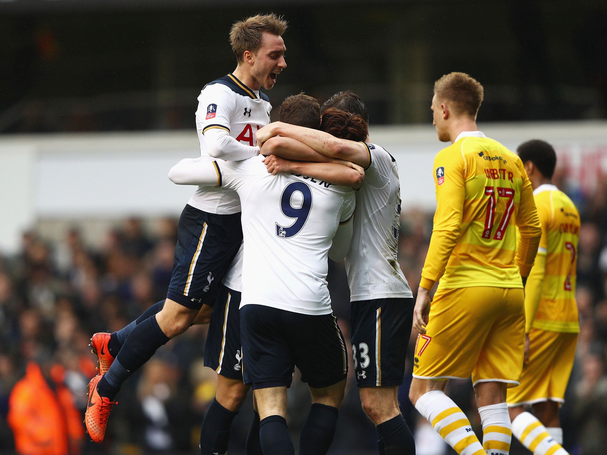 Vincent Janssen's teammates rush to celebrate with him after scoring his first goal for Spurs from open play