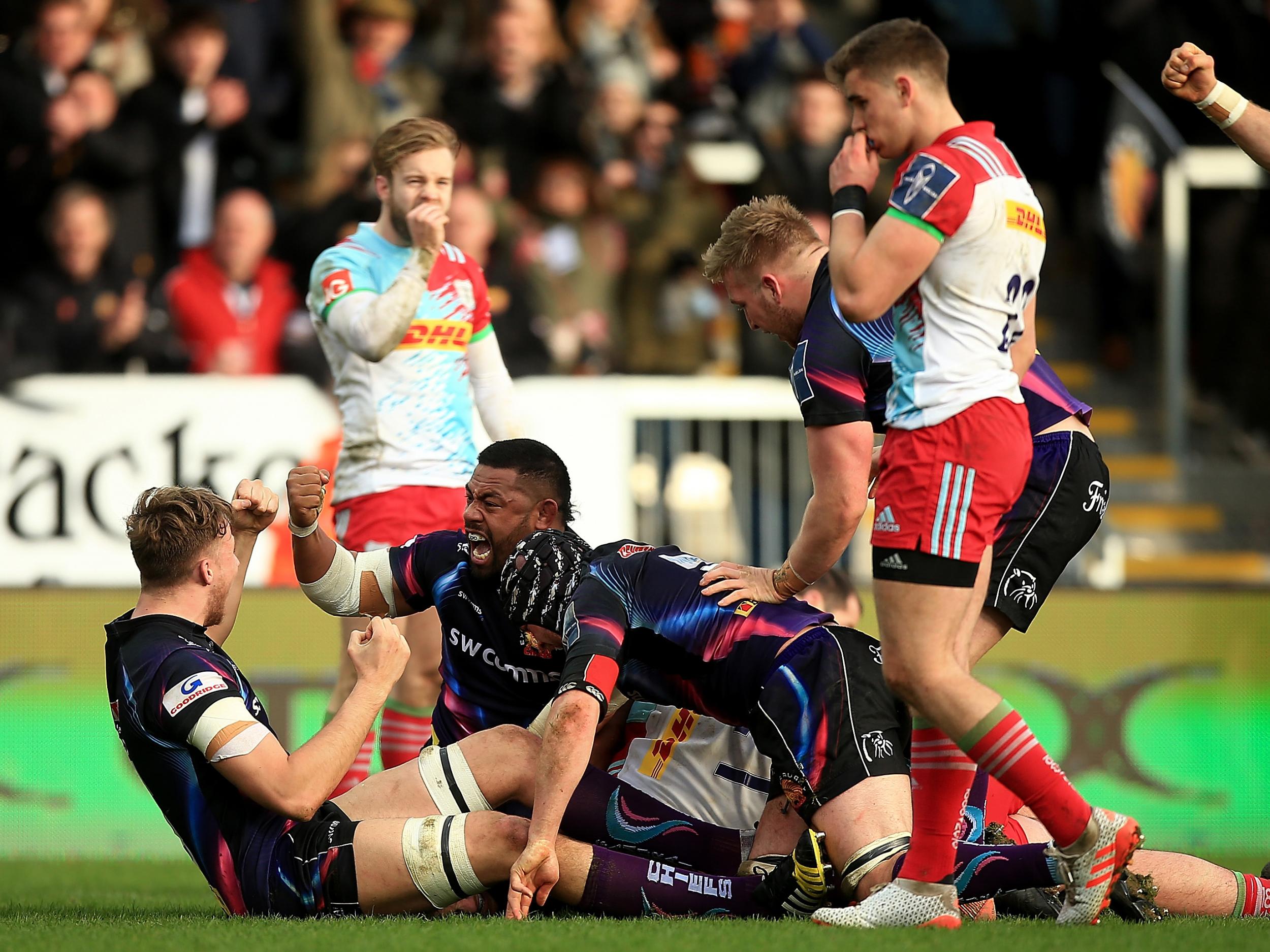 Elvis Taione of Exeter celebrates after team mate Sam Simmonds scores a try