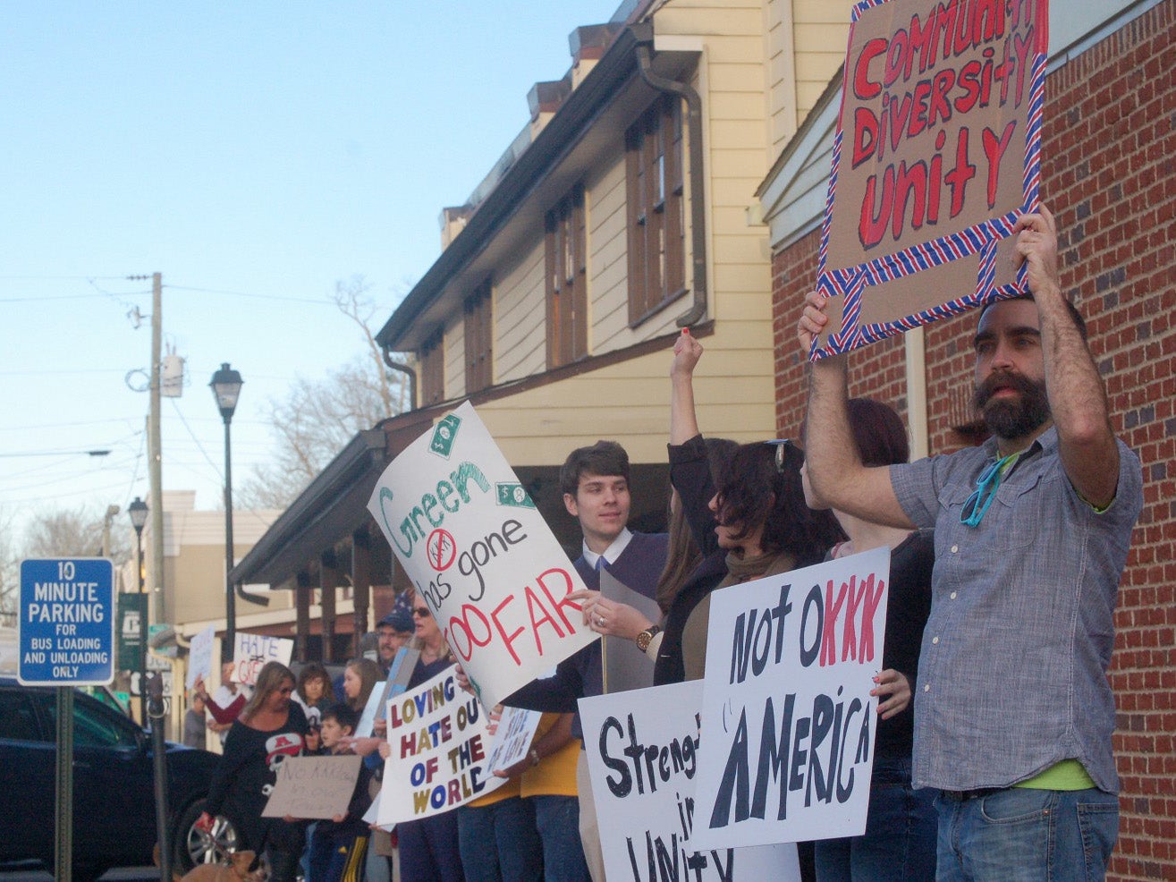 Protesters rally February 17 in Dahlonega after a KKK sign was displayed on a vacant building downtown