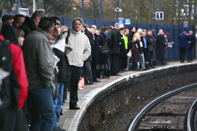 Commuters waiting on a platform as up to 2,000 workers at three rail companies will go on strike in separate disputes over staffing, threatening some of the worst disruption since the industry was privatised
