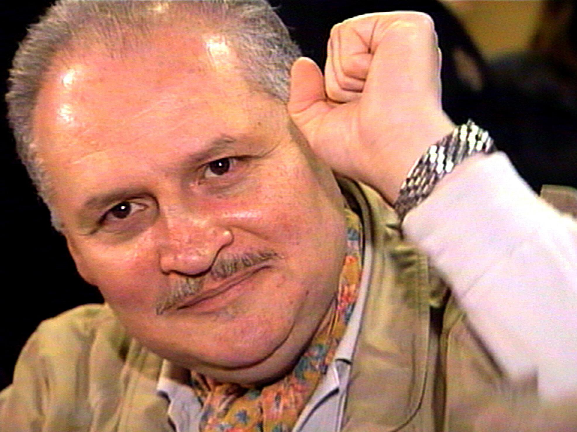 'Carlos the Jackal' raises his fist as he appears in court in Paris in November 2000