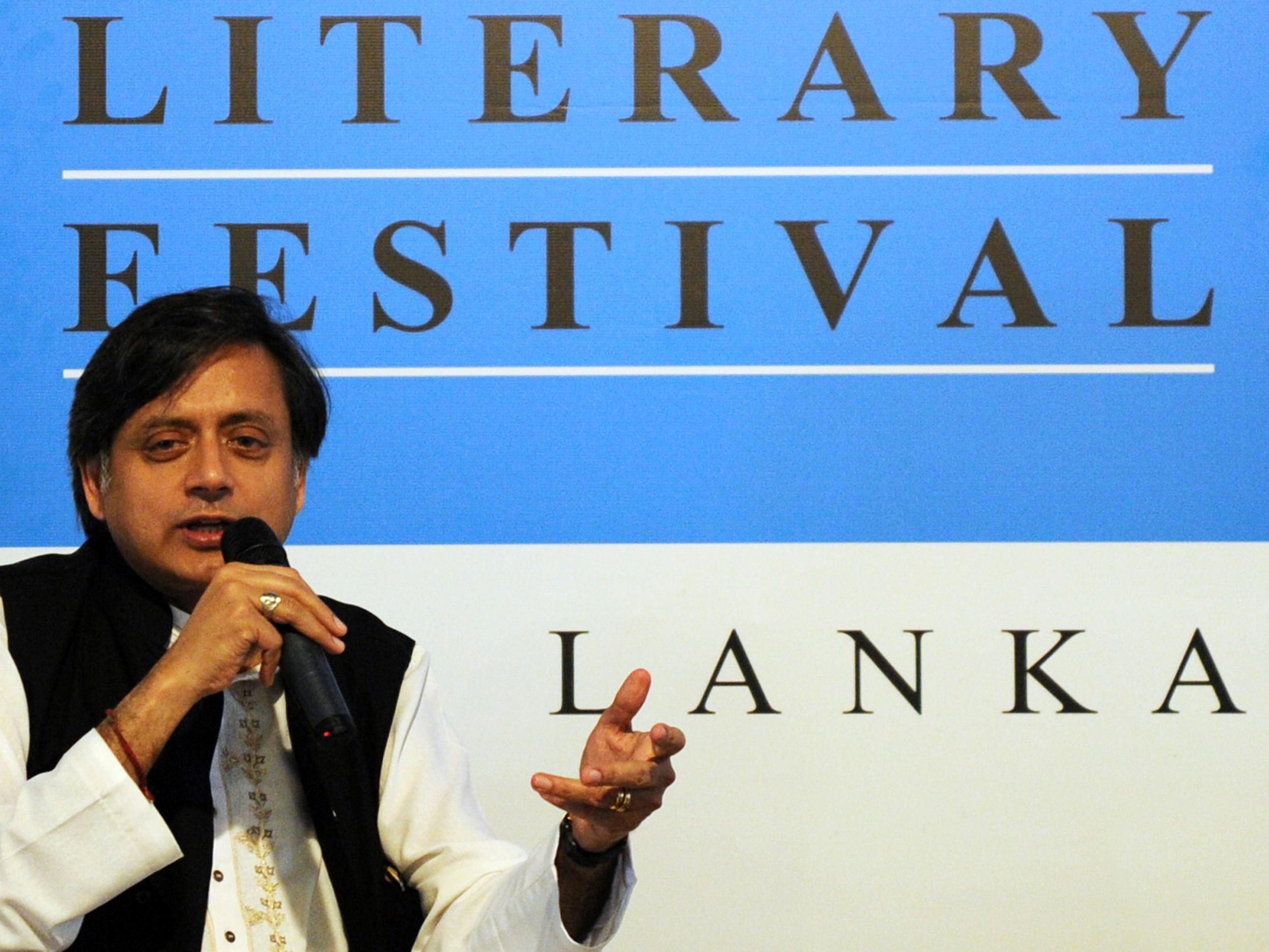 Indian ruling parliamentarian Sashi Tharoor talks to the co-founder of Sri Lanka's leading citizen journalism website Groundviews