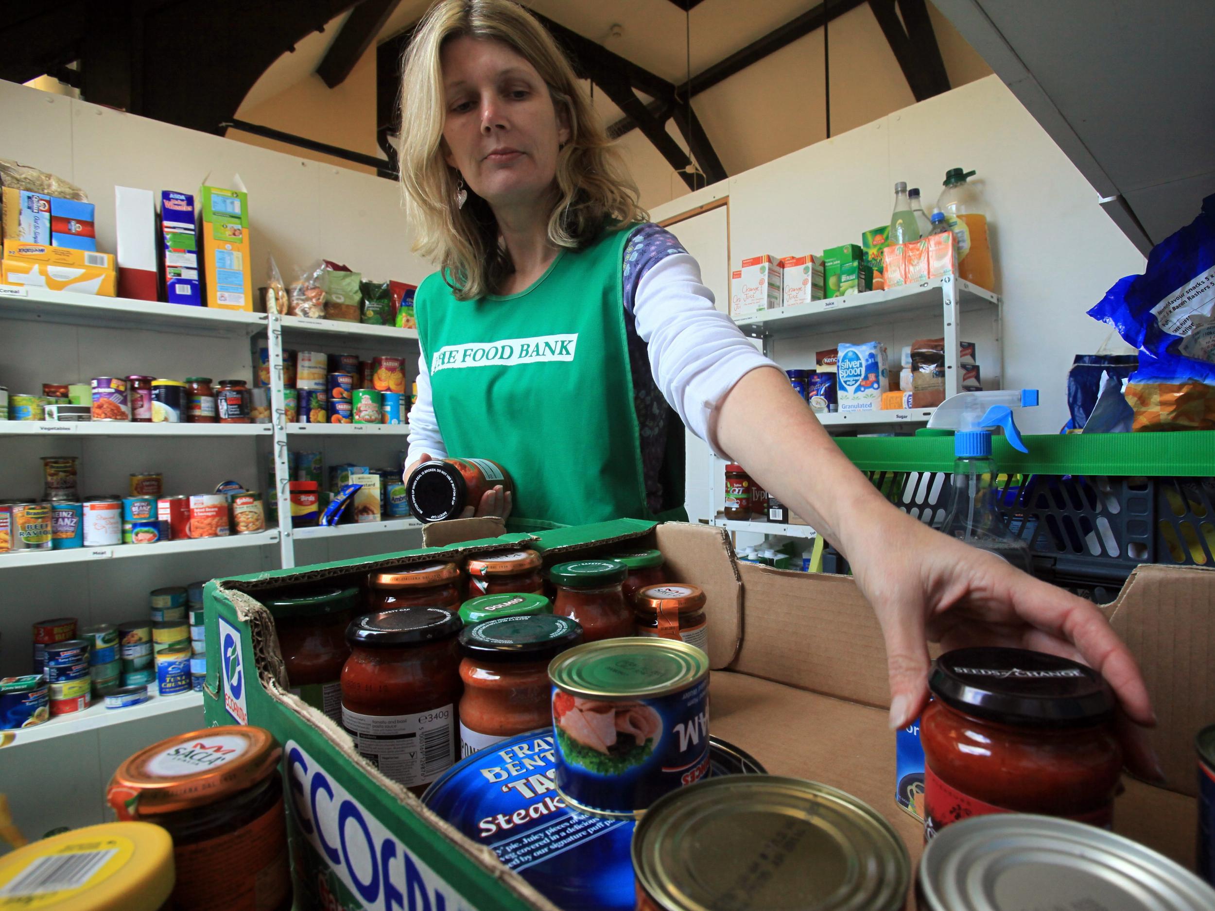 A food bank volunteer sorts through donations in Salisbury, England