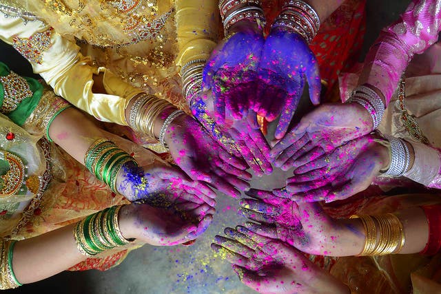 Indian girls celebrates Holi, the Festival of Colours in Dharmanagar, in the north eastern state of Tripura