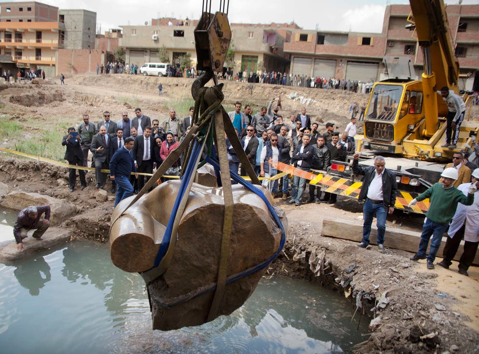 A massive statue, that may be of pharaoh Ramses II, one of the country's most famous ancient rulers, is pulled out of grondwater in Cairo