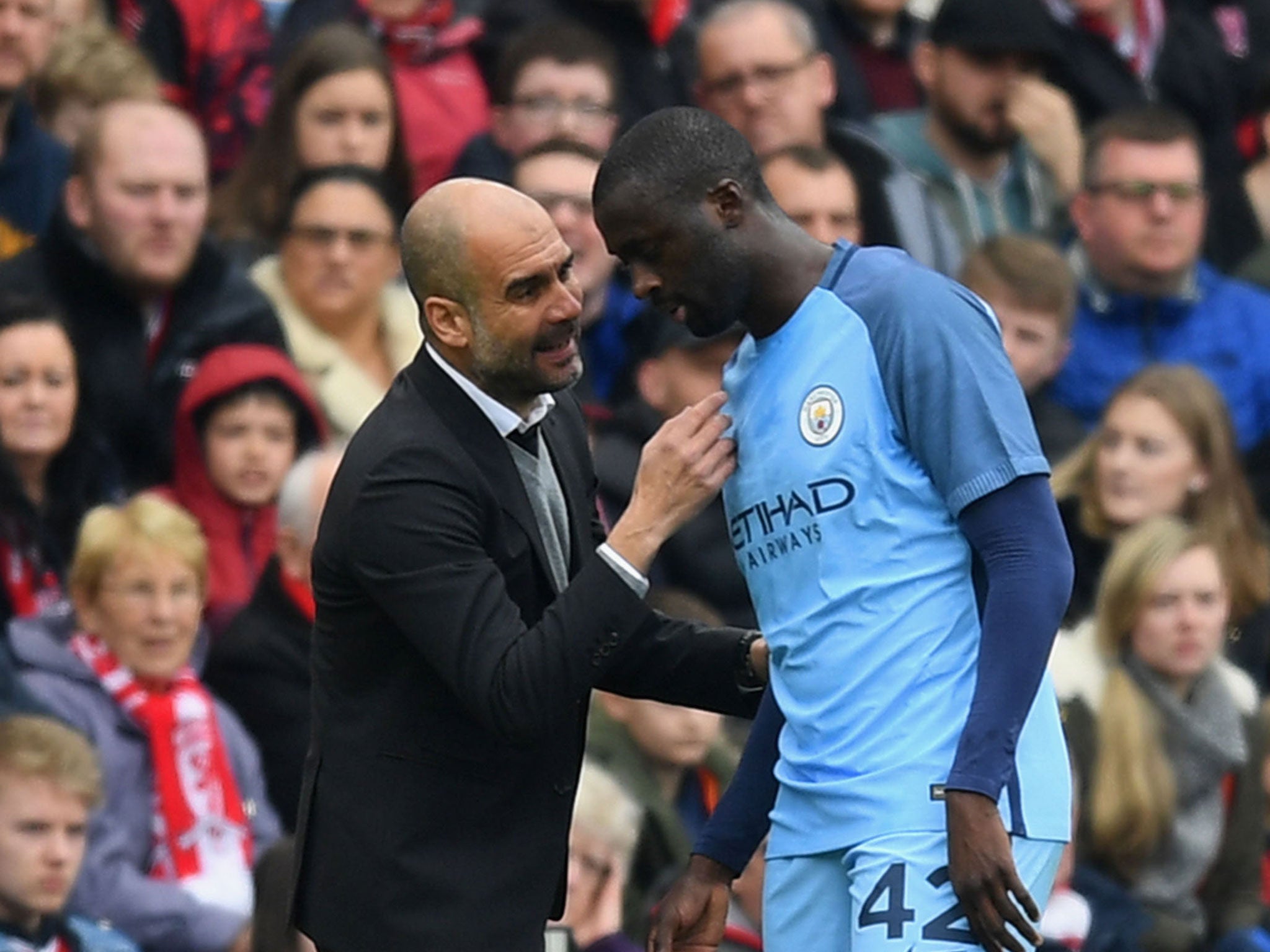 Guardiola talks to Toure during Saturday's FA Cup game against Middlesbrough