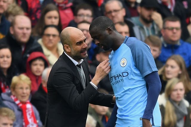Guardiola talks to Toure during Saturday's FA Cup game against Middlesbrough