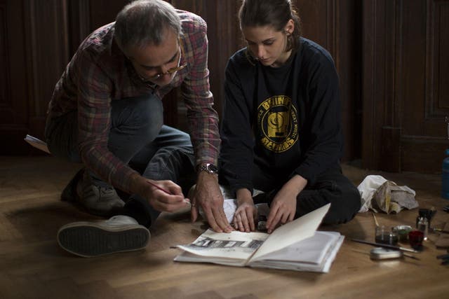 The film director Olivier Assayas and Kristen Stewart on set of 'Personal Shopper' 