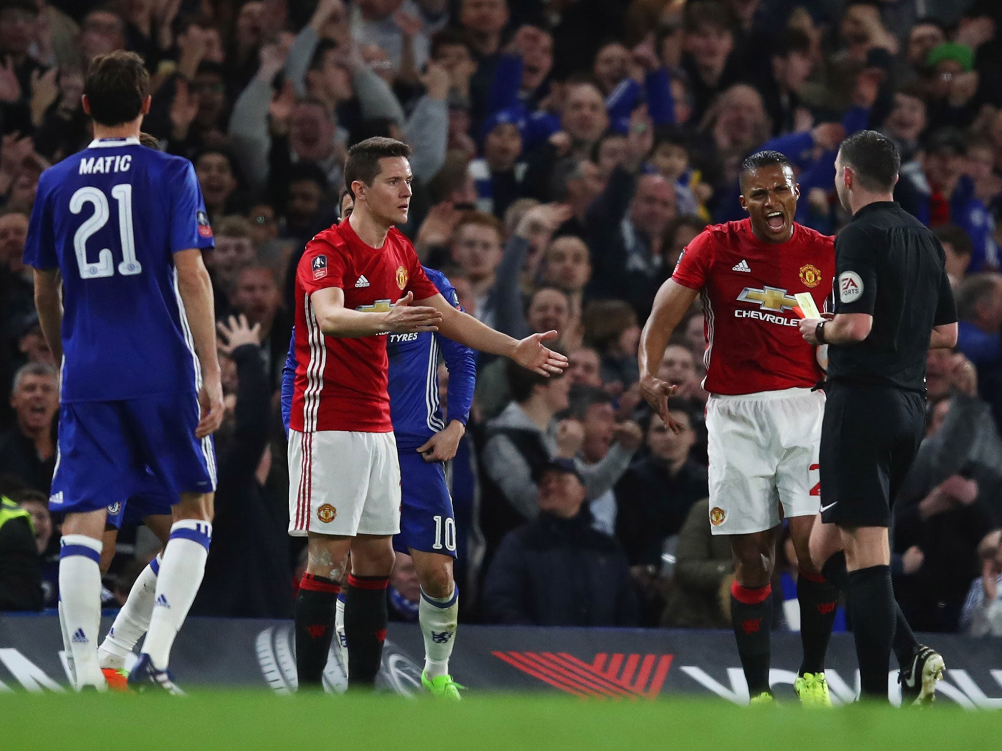 Michael Oliver shows Ander Herrera red after the Spaniard picked up his second yellow card