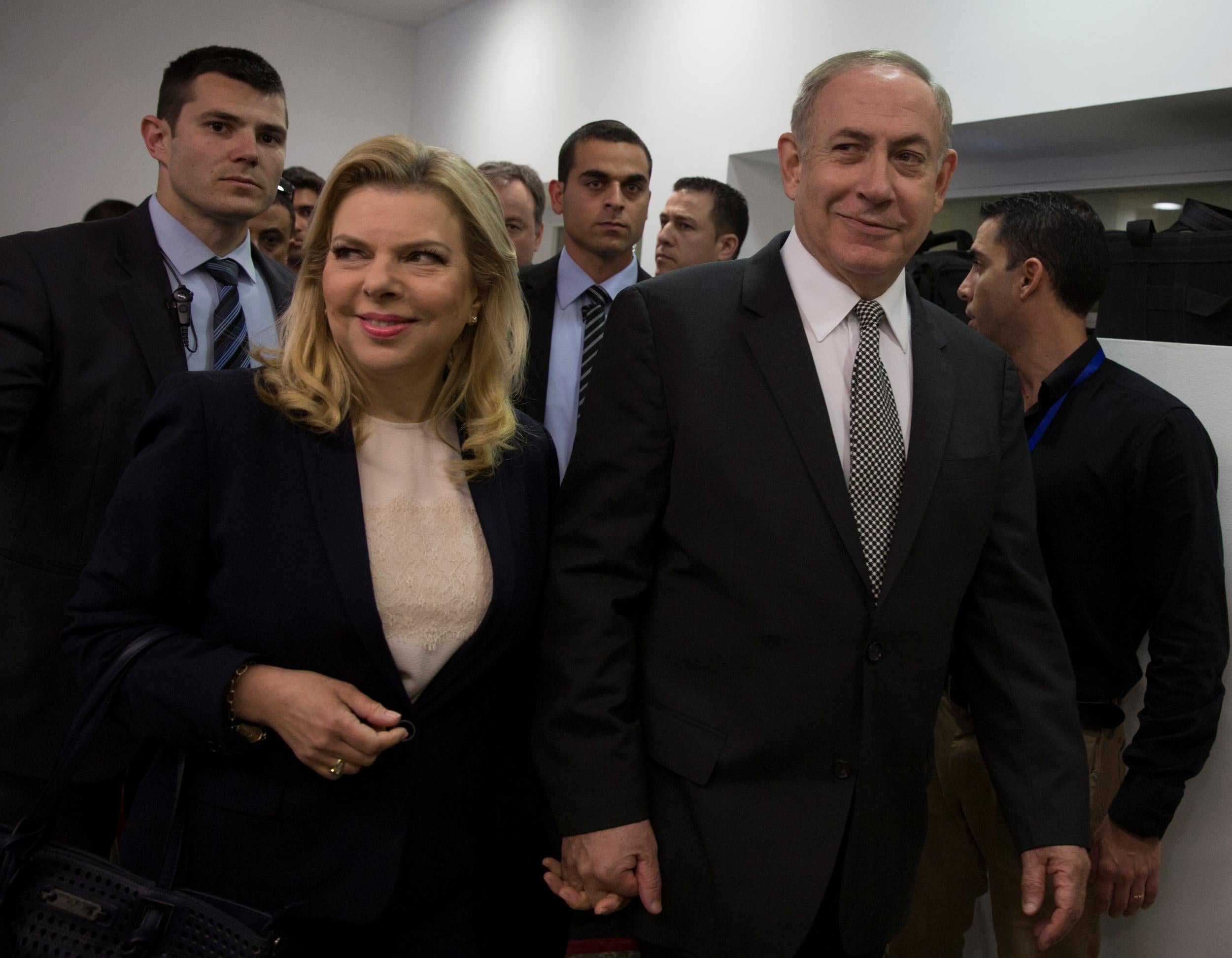 Israeli Prime Minister Benjamin Netanyahu and his wife Sara arrive at court to testify in a libel lawsuit they filed against an Israeli journalist in Tel Aviv on March 14, 2017