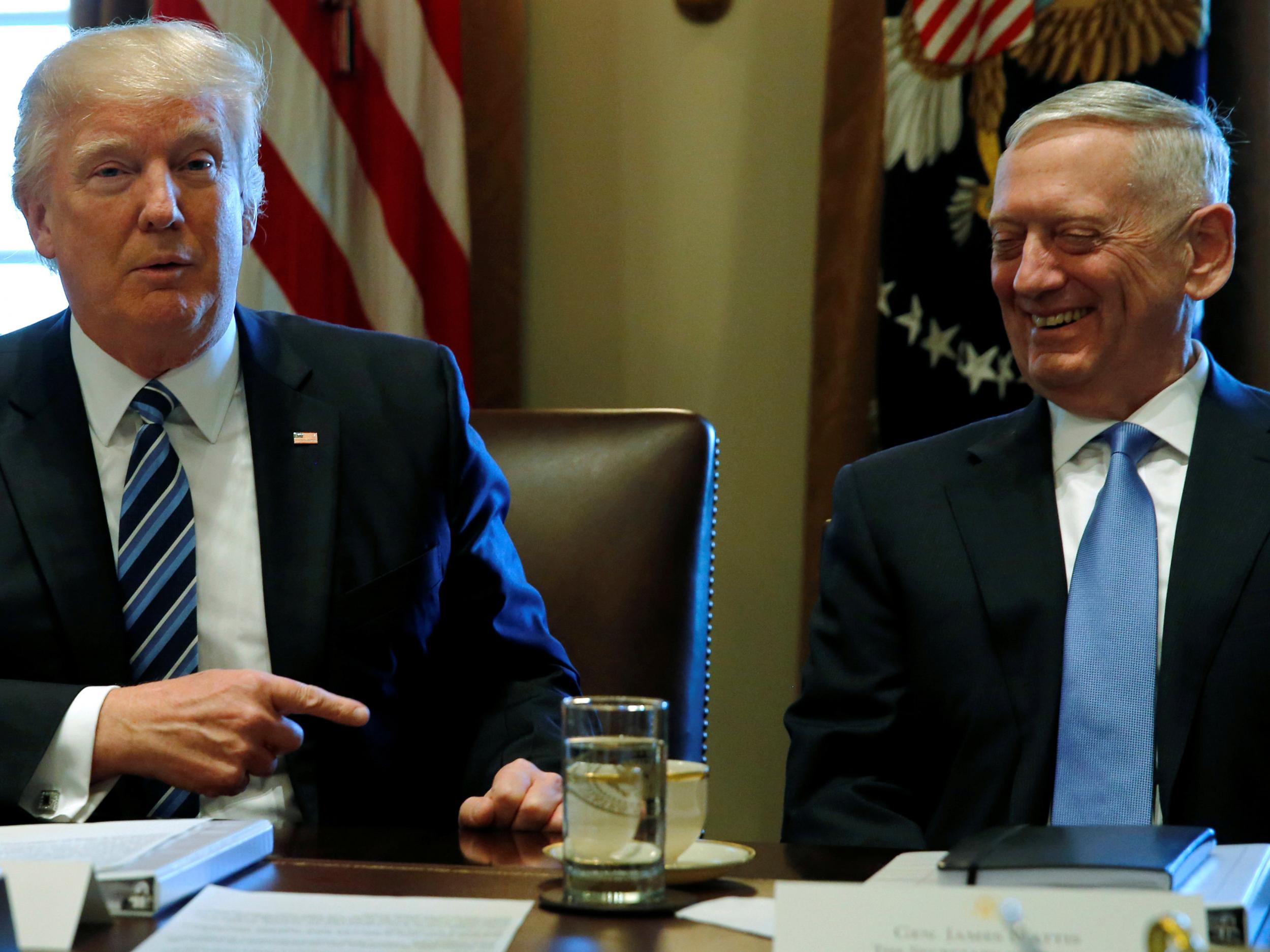 President Donald Trump chairs a Cabinet meeting at the White House in Washington, flanked by General James Mattis
