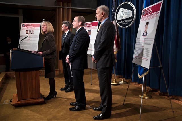 Acting Assistant Attorney General of National Security Mary McCord (L) speaks during a press conference to announce criminal charges against three Russians for the 2014 hacking of Yahoo at the US Department of Justice March 15, 2017 in Washington, DC