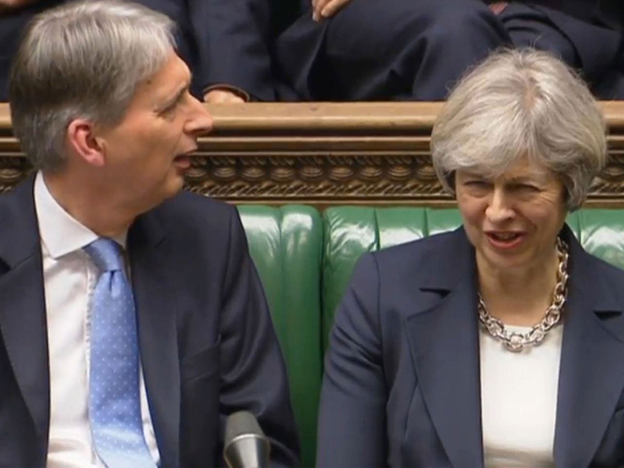 Chancellor Philip Hammond and Prime Minister Theresa May listen to Shadow Chancellor John McDonnell speaking in the House of Commons
