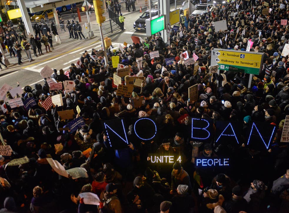 A demonstration against Donald Trump's immigration ban at John F Kennedy International Airport on 28 January