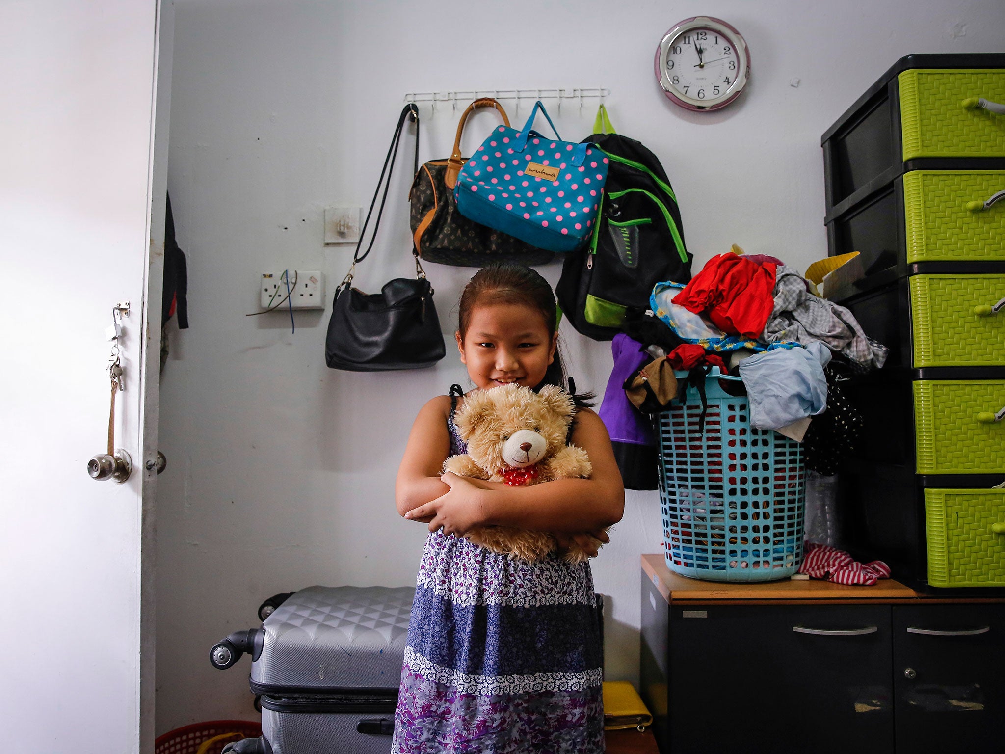 Burmese Christian refugee Sarah with her favorite teddy bear in Kuala Lumpur