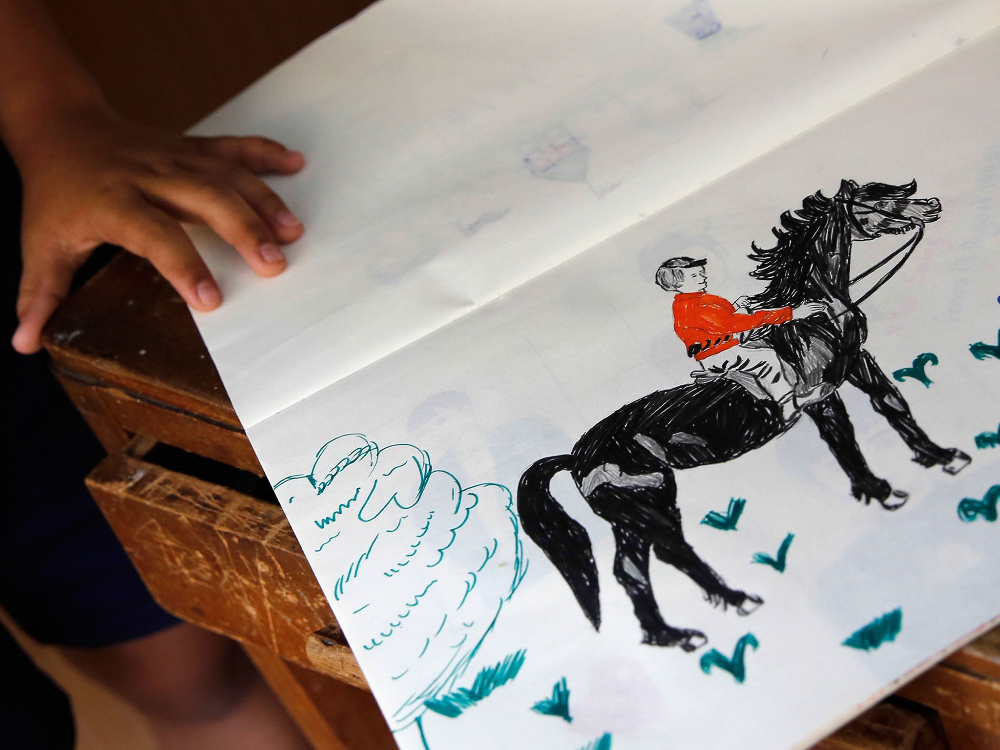 A 13-year-old Burmese Christian refugee explains one of her favorite drawings