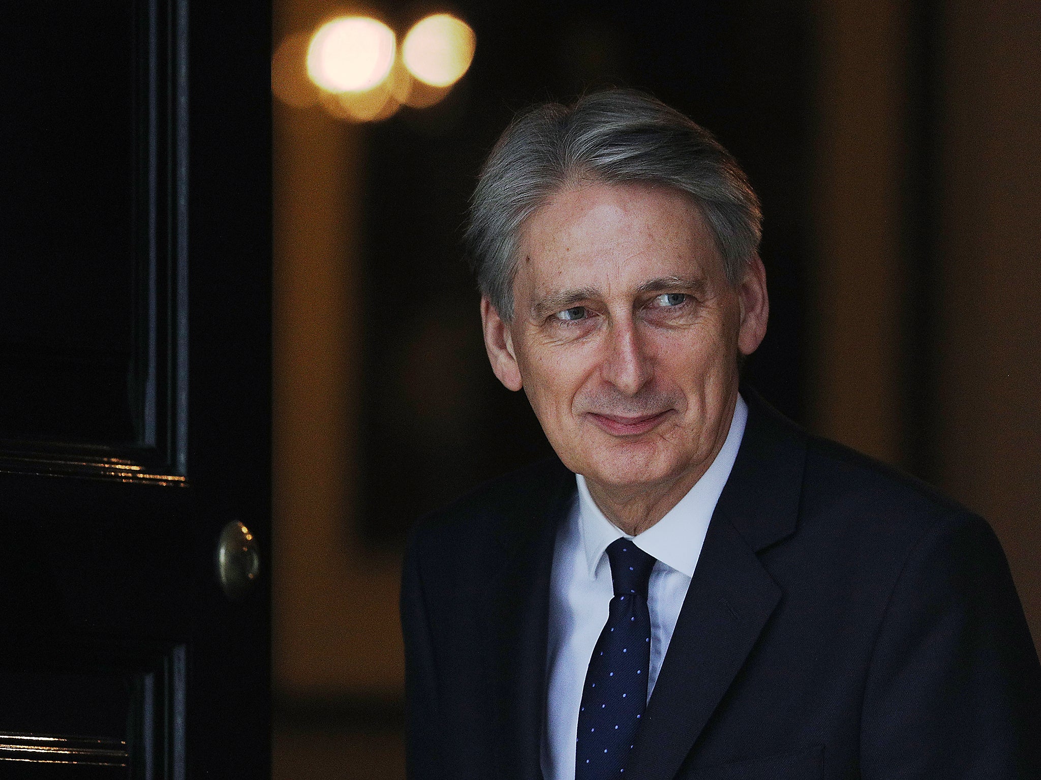 Chancellor Philip Hammond walks out of 11 Downing Street to greet the US Secretary of the Treasury Steven Mnuchin
