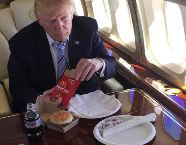 <p>Donald Trump eating McDonald’s on a plane</p>