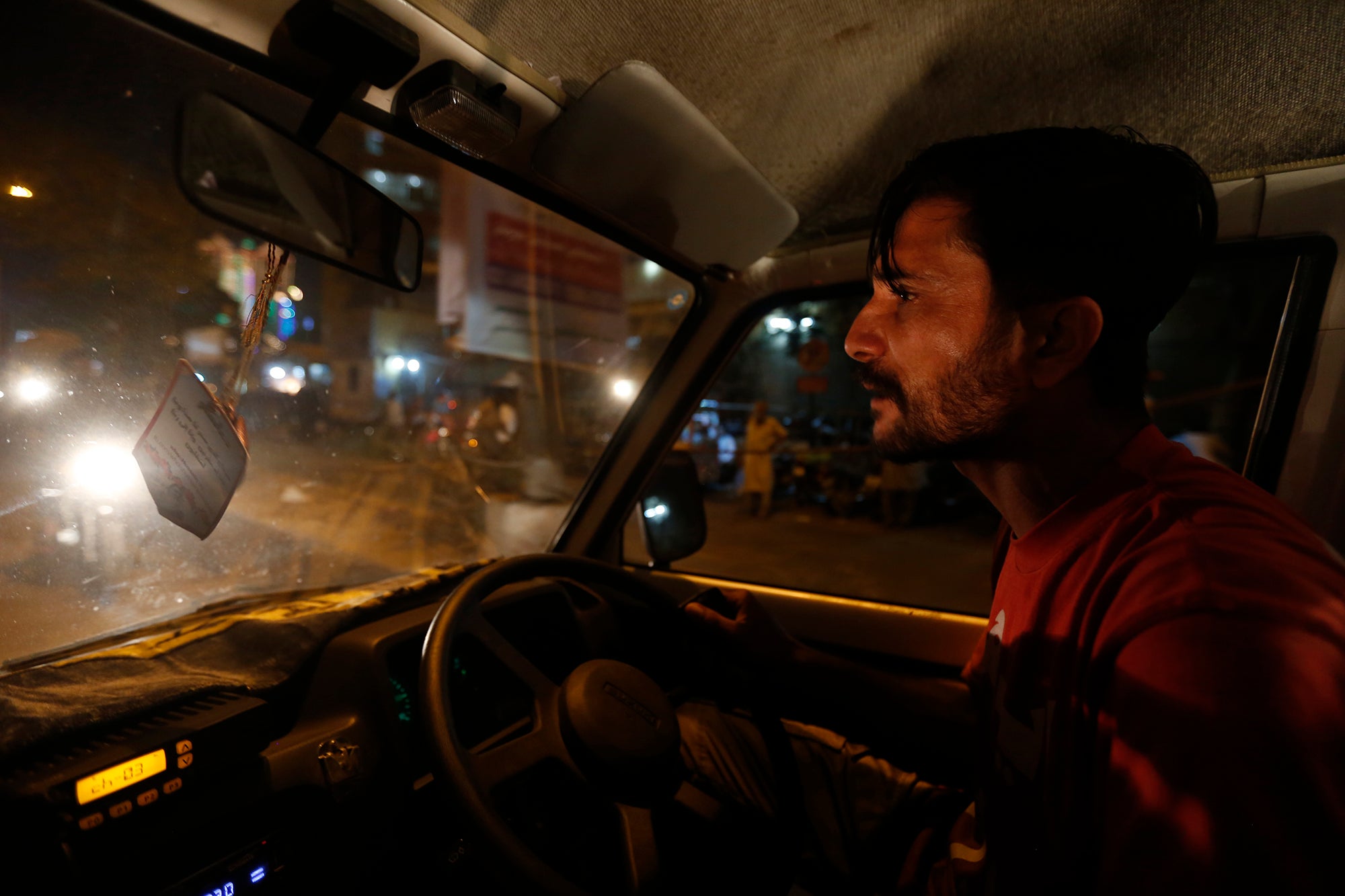 Ambulance driver Safdar Mohamma attends an emergency