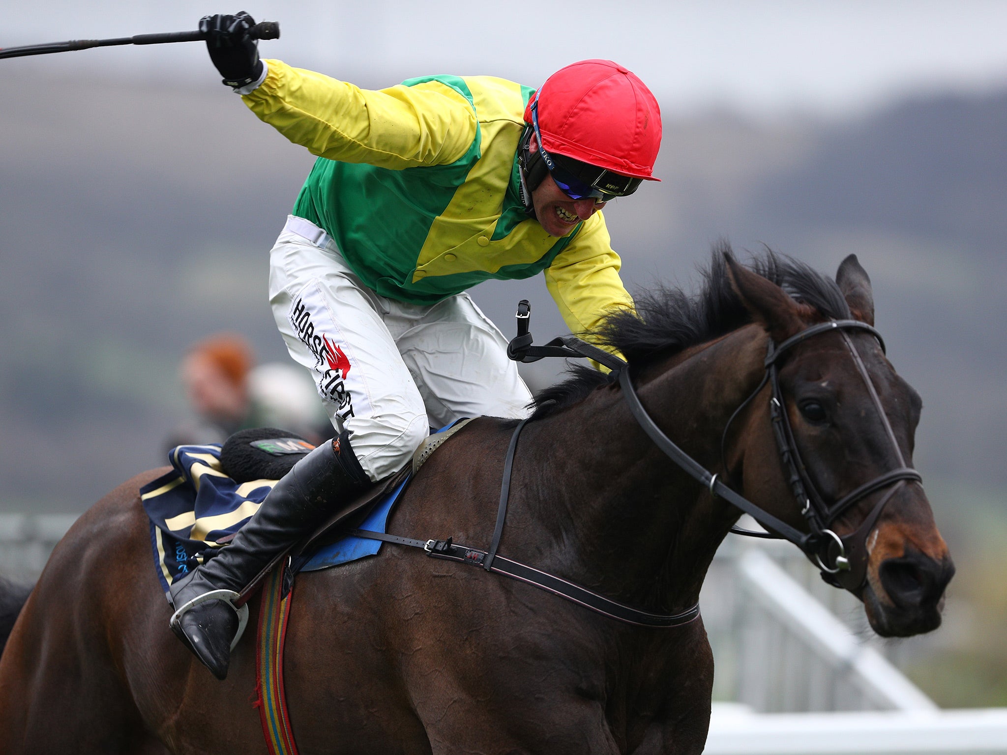 Sizing John surged home from the last fence to earn Jessica Harrington a first Gold Cup