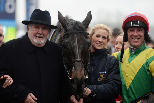 Alan Potts, left, poses with his victorious horse Sizing John and jockey Robbie Power