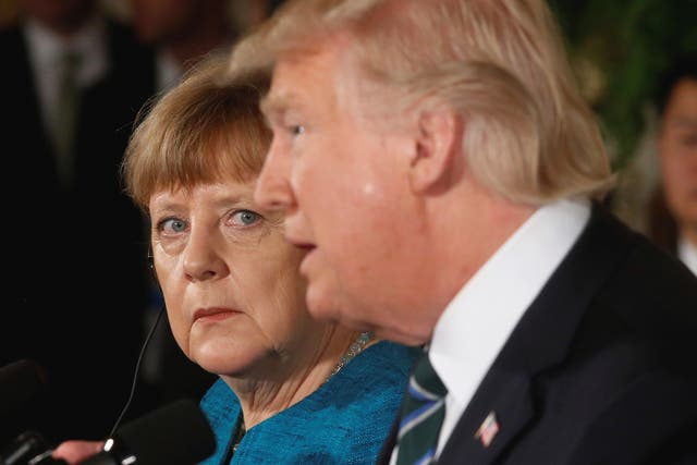 Germany's Chancellor Angela Merkel and US President Donald Trump hold a joint news conference in the East Room of the White House