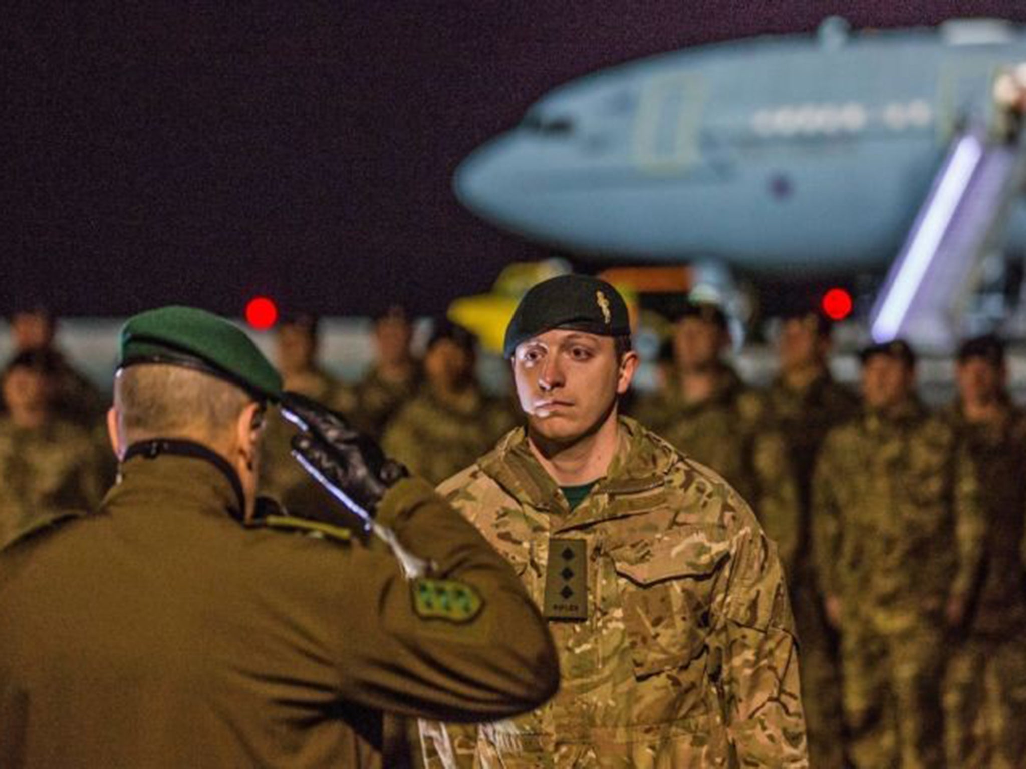 UK soldier receiving a salute as troops arrive at the Amari airbase, 25 miles south-west of Tallinn