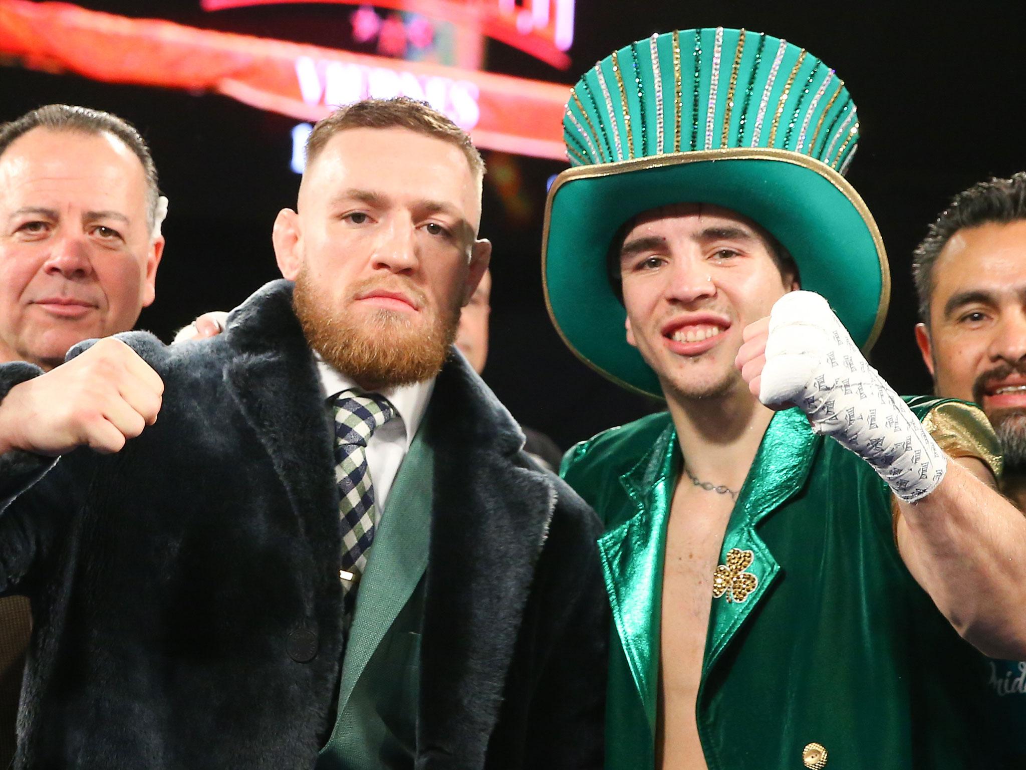 Conor McGregor, & Michael Conlan celebrate Conlan's 3rd round TKO win over Tim Ibarra in his super bantamweight bout at The Theater at Madison Square Garden