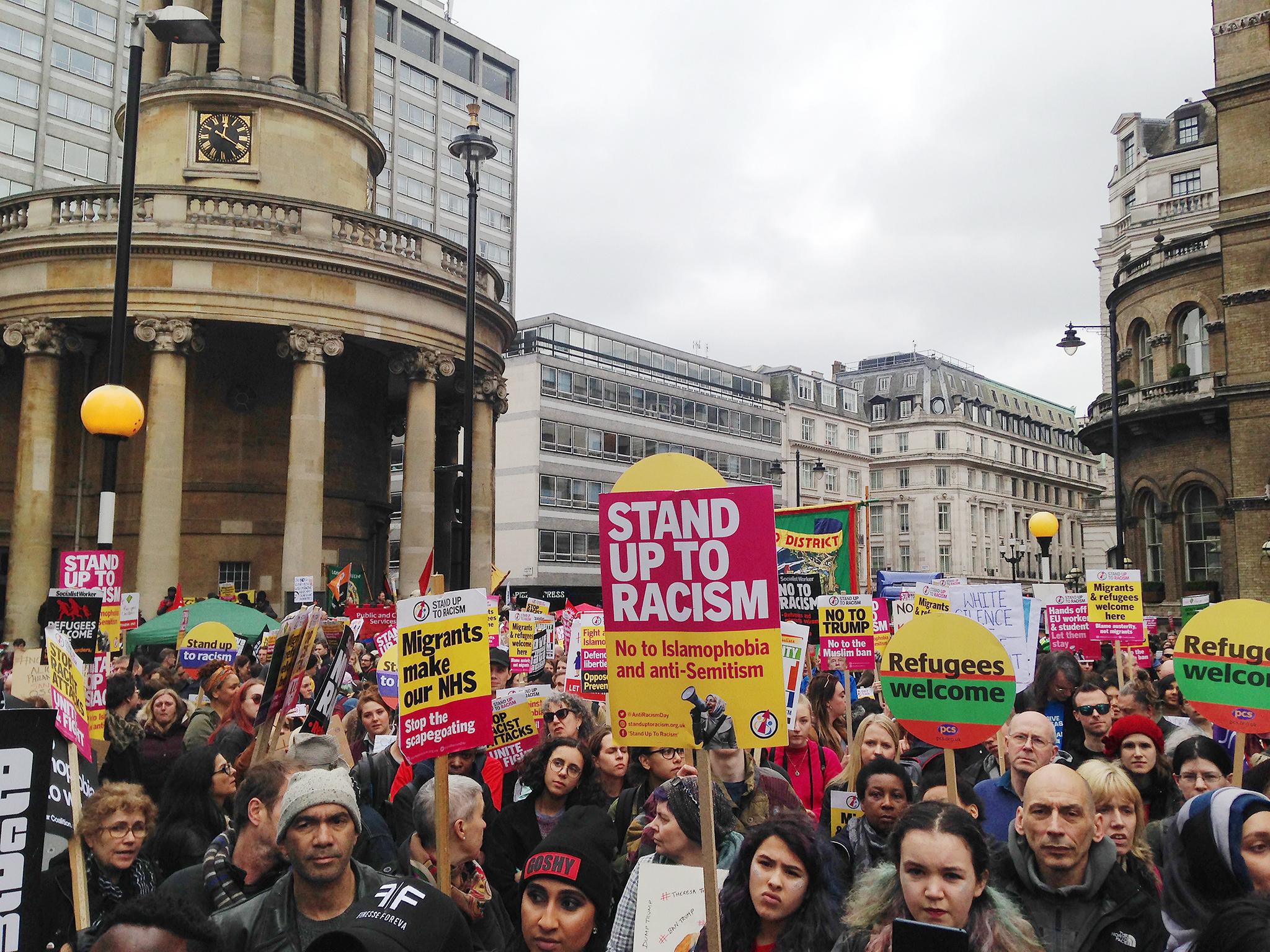 Protesters arrived at Portland Place in Central London at around midday holding banners adorning defiant messages of solidarity